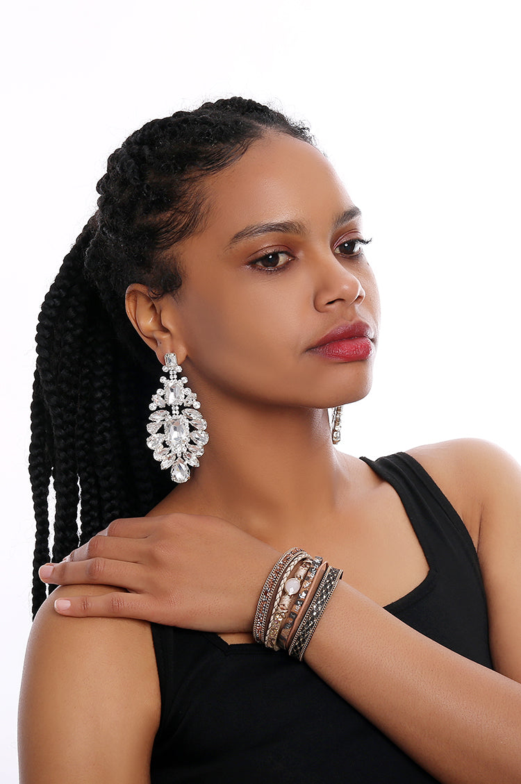 africanfemale_statementearrings_bracelets_whitebackground_longhair_makeup